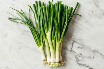 Fresh Green Onions on White Marble, Overhead View