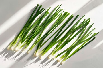 Artistic Layout of Green Onions on Bright White Background