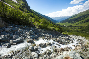 Fototapeta na wymiar Stream from Sofia waterfalls, Arkhyz, Karachay-Cherkessia. Russia