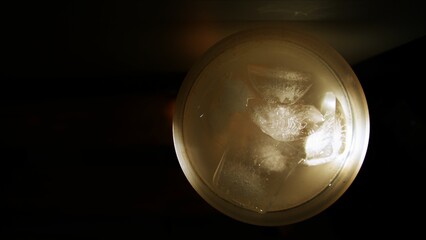 A homemade lemon juice cup, close-up shot. Fruit juice, top view. A lemon juice jar. Lime juice. Lemonade cup. Lemonade jar. A lemonade glass. A fresh beverage. Lemonade with ice cubes.
