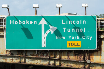 Hoboken and Lincoln Tunnel Entrance Sign Directing to New York City During Daytime