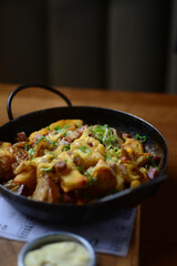 Papas con cheddar