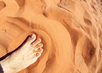 Foot in the red sand