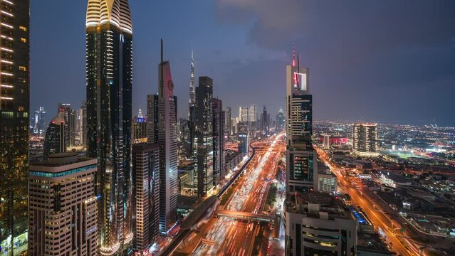 Dusk to night timelapse view of traffic and skyscrapers along Sheikh Zayed Road in Dubai, United Arab Emirates (UAE).
