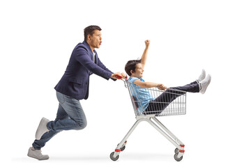 Young man pushing his kid inside a shopping cart
