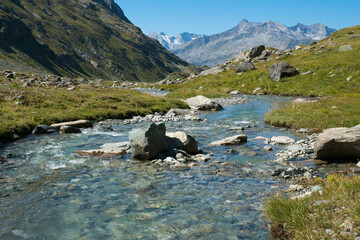 Panoramic view of alpine river in Valle Aurina, Alto Adige, Italy