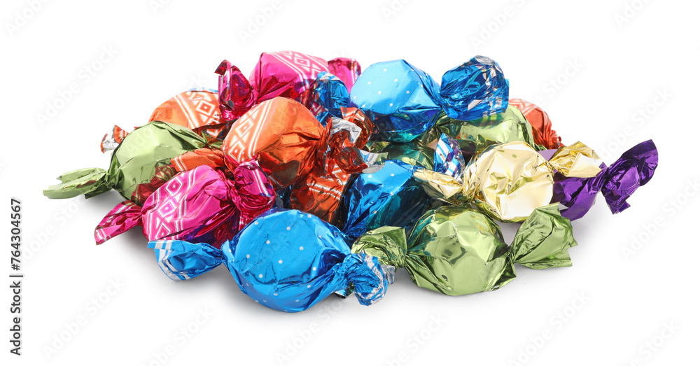 Wall mural pile of sweet candies in colorful wrappers on white background