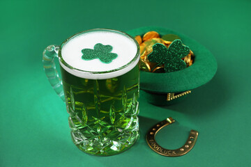 St. Patrick's day party. Green beer, leprechaun hat with gold, horseshoe and decorative clover...