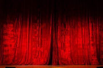 Theater curtain Red hanging on empty stage. Entertainment event about to begin