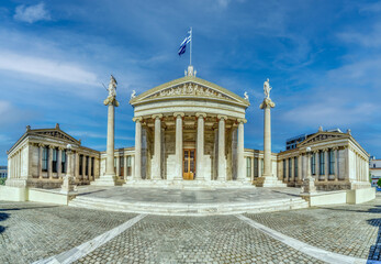 Fototapeta na wymiar Hig hdefiniton panorama of Masterpiece Academy of Athens featuring statue of Athena, Apollo above and Socrates and Plato below, in the heart of Athens, Attica, Greece