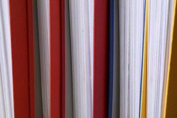 Colorful binder office folders as background, closeup