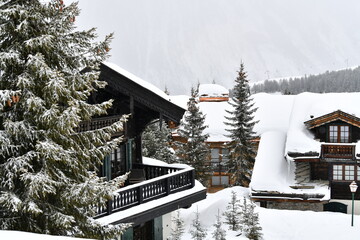 Winter scenery with chalets covered with snow 