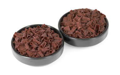 Delicious chocolate shavings in bowls isolated on white