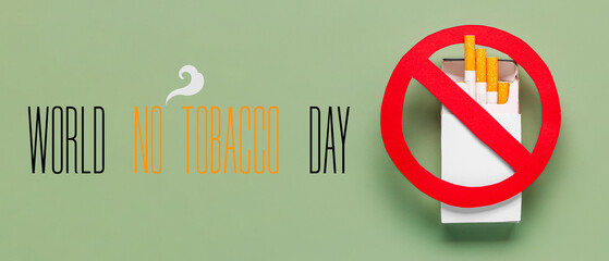 Box of cigarettes with STOP sign on green background. Lung cancer concept