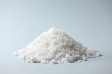 Heap of natural salt on color background