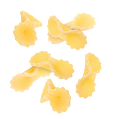 Raw farfalline pasta falling on white background