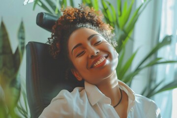 smiling woman sitting in an armchair, work, business,  - obrazy, fototapety, plakaty