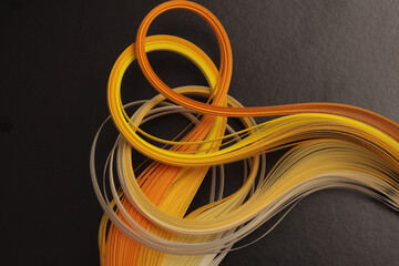 Yellow Orange Color strip gradient wave paper on black . Abstract texture background.