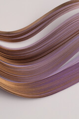Gold bronze, violet Color strip gradient wave paper on beige. Abstract texture background.