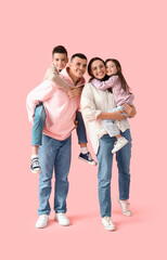 Fototapeta premium Little children with their parents on pink background