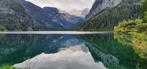 Reflecting mountains in a mountain lake in Austria. Gosausee Austria 2022