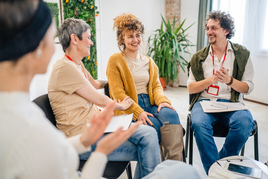 Support Group with Therapists and Woman in Focus solving problem