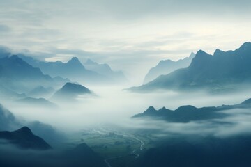 Fototapeta na wymiar Distant mountain range shrouded in mist, creating an air of mystery