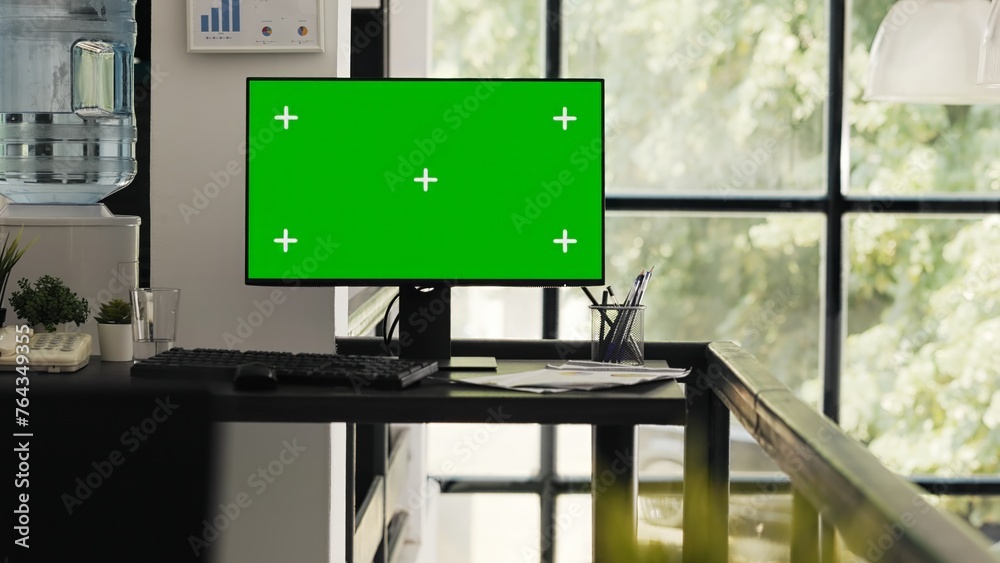 Poster empty office with greenscreen desktop showing isolated copyspace layout in open floor plan coworking
