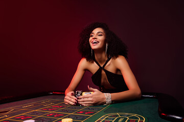 Photo of addicted happy ladyon night party have fun in las vegas poker club collect all chips win black jack jackpot