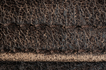 Macro texture of worn brown cowhide leather