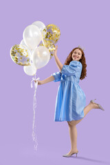 Young redhead woman in crown with balloons on lilac background