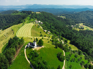 Aerial View of Sveti Jakob Hill with a Church on Top. Slovenia, Europe - 764365742
