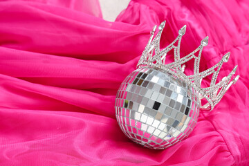 Female pink prom dress with disco ball and crown, closeup © Pixel-Shot