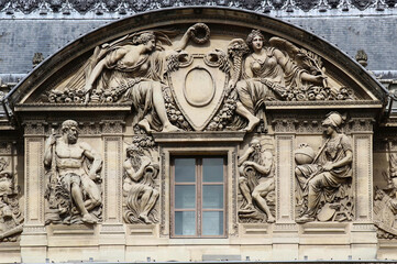 Some architectural details of the building that houses the Louvre museum in Paris, France, one of...