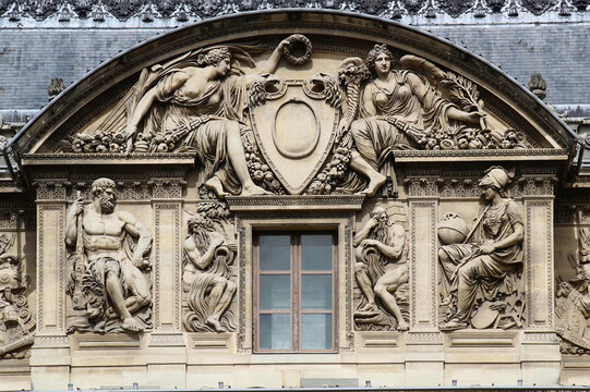 Some architectural details of the building that houses the Louvre museum in Paris, France, one of the most famous museums in the world