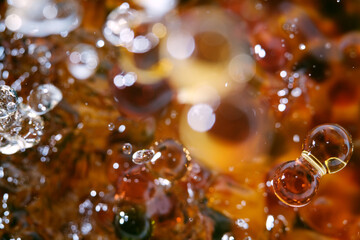 Macro shot of drop pearl bubbles on water