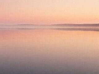 the sky a gradient of soft oranges and pinks, reflected in the still waters of a solitary lake