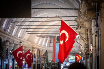 Selective blur on Turkish flags hung in the grand bazaar. Also known as kapalicarsi, it is one of...