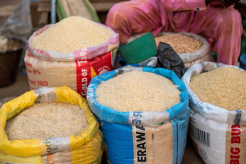 Rice, White Beans displayed for sale at Bodija Market in Oyo, Nigeria on Monday, February 19, 2024. Earlier today, citizens voiced their discontent over difficulties and rising expenses of daily life - obrazy, fototapety, plakaty