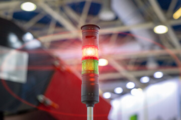 A Signal Tower. Traffic light at the machine. Red traffic light in a factory workshop. Industrial...