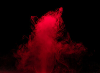 Abstract background of chaotically mixing puffs of red smoke on a dark background