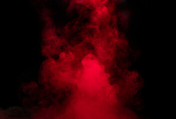 Abstract background of chaotically mixing puffs of red smoke on a dark background
