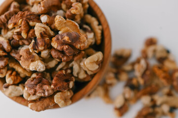 Roasted walnuts on white background