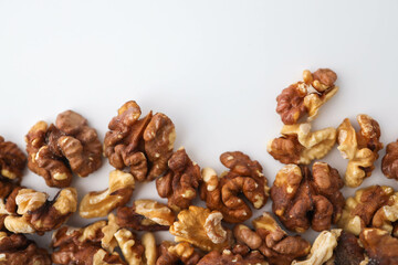 Roasted walnuts on white background