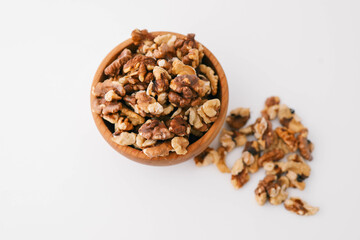 Roasted walnuts on white background