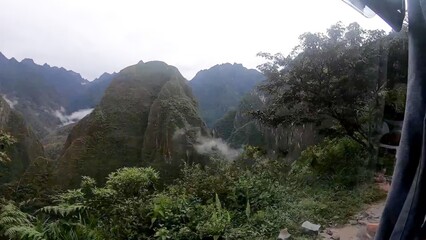 Enchanting view of mist-covered mountains in a tropical forest in Machu Picchu - Peru