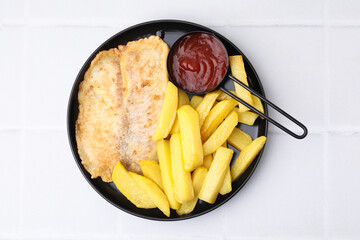 Delicious fish and chips with ketchup on white tiled table, top view