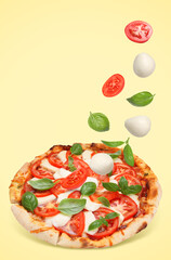 Caprese pizza and ingredients in air on pale yellow background