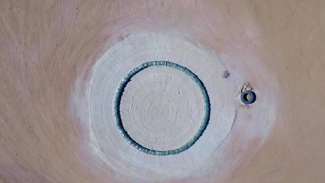 Aerial Top Upward Shot Of Sand Bags Formed In Circle Shape On Sunny Day - Agua Dulce, California