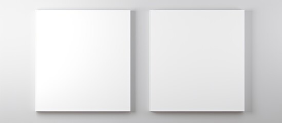 Two blank white vertical banners are hanging on a wall, ready for customization and display - obrazy, fototapety, plakaty